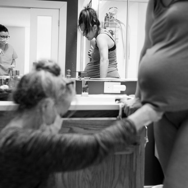 midwives-check-baby-heartrate-bw-sm